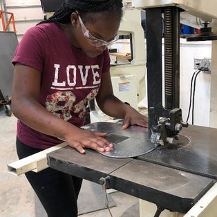 STEAM Studio student at the Bandsaw